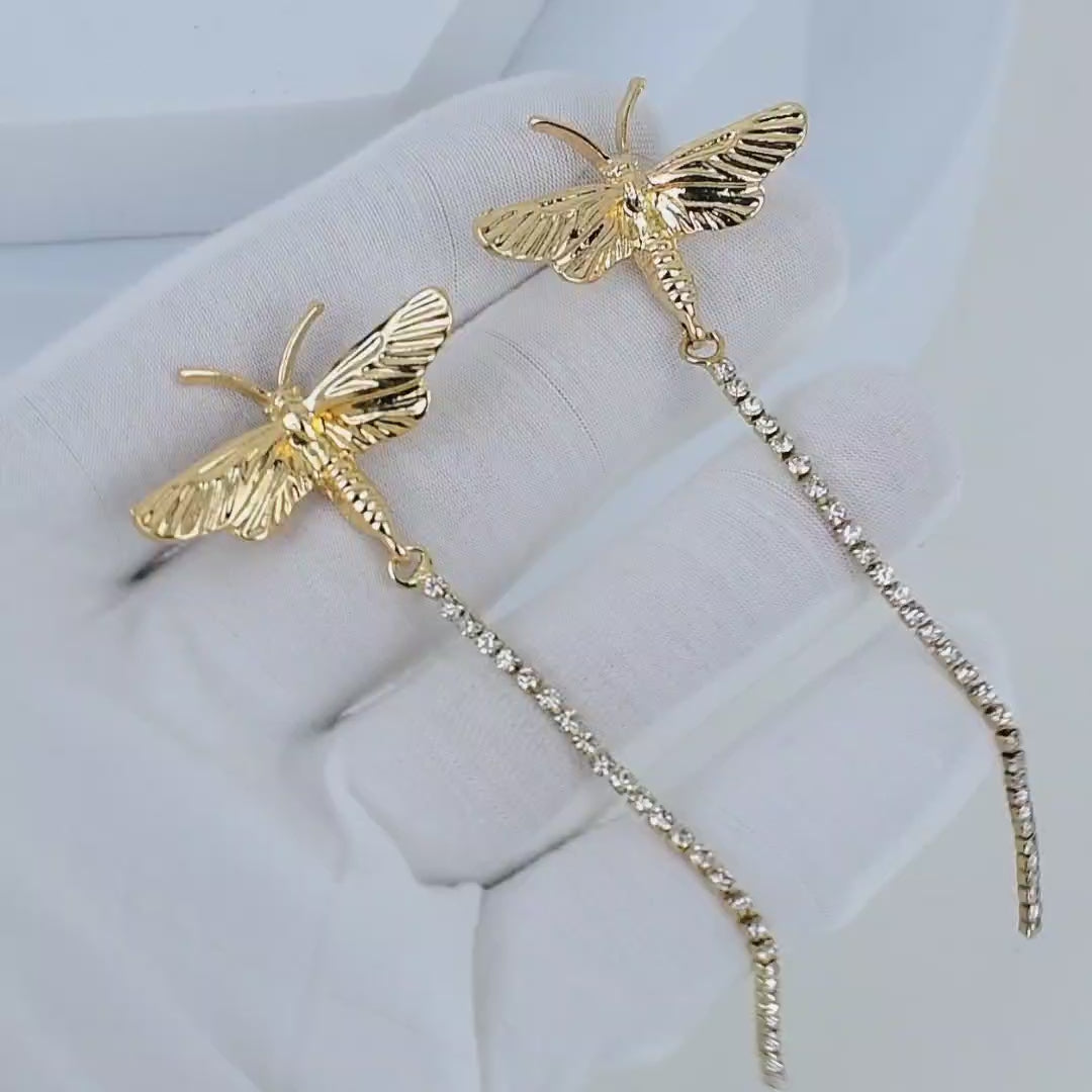Video showing the fluid movement and brilliant shimmer of the linear crystal chains on the gold Chrysalis earrings
