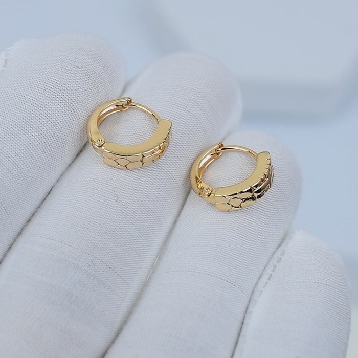 ARC Cross Mini Hoops rotating to show minimal cross detail in stainless steel