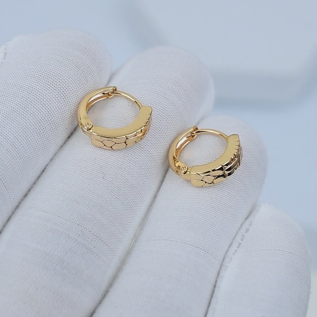 ARC Cross Mini Hoops rotating to show minimal cross detail in stainless steel
