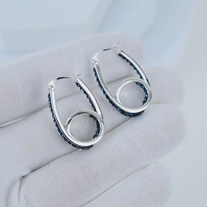 Video showcasing midnight blue crystal double hoop earrings with sparkling crystal detailing