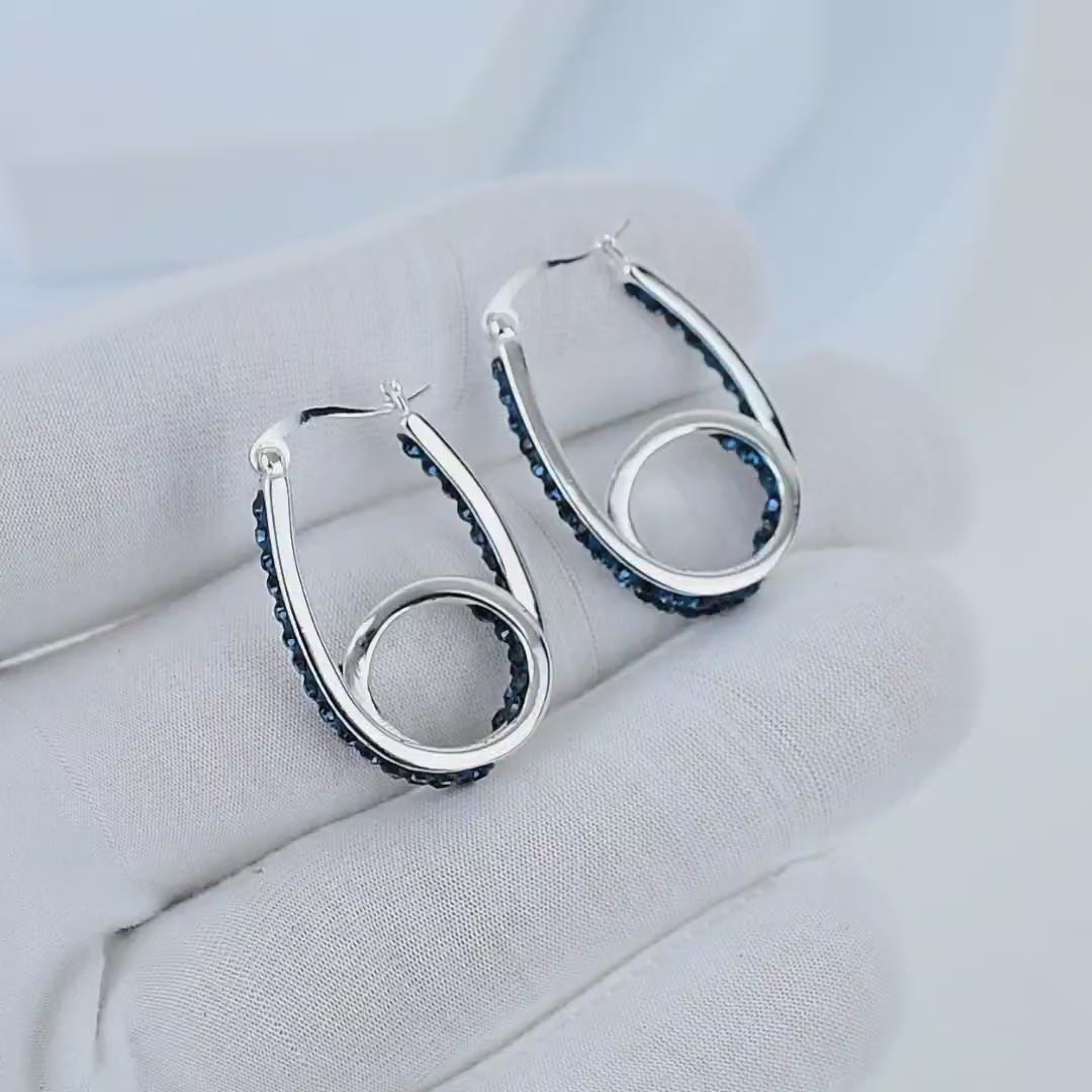 Video showcasing midnight blue crystal double hoop earrings with sparkling crystal detailing