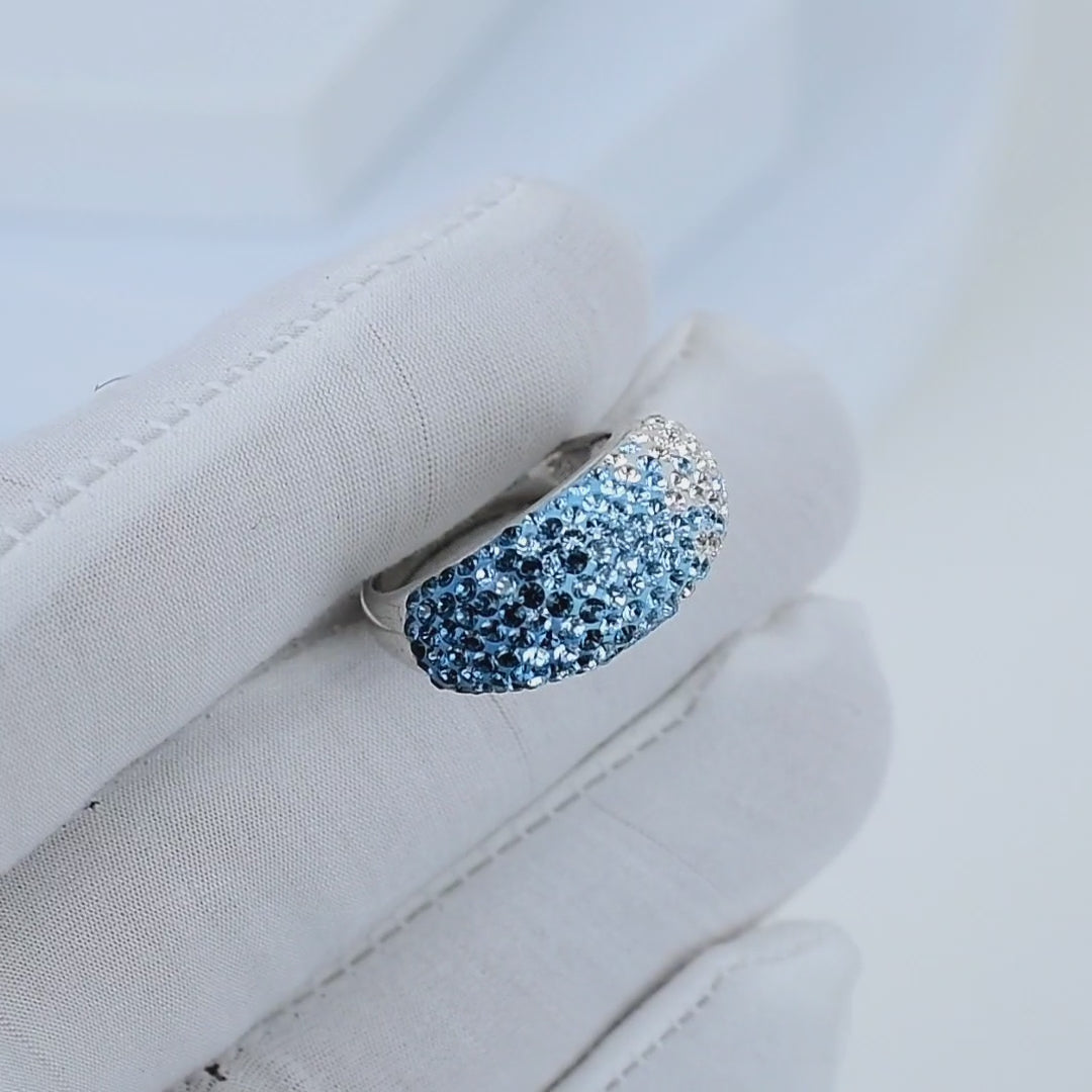 Video showing the fluid light reflection and the seamless color transition across the crystals of the handcrafted Signature Ombré Dome ring