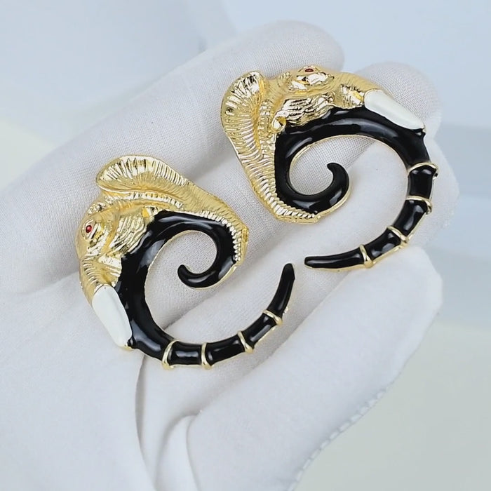 Elegant statement earrings with elephant motif and curved silhouette by civaro