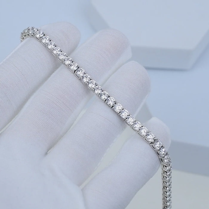     Classic 925 sterling silver tennis bracelet with cubic zirconia stones shown in motion, highlighting sparkle and flexibility