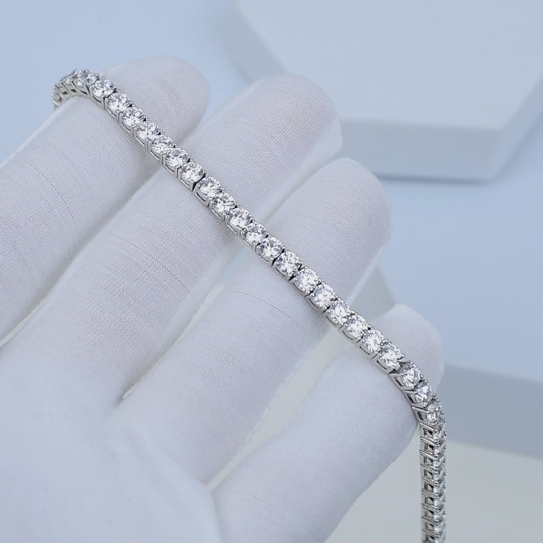     Classic 925 sterling silver tennis bracelet with cubic zirconia stones shown in motion, highlighting sparkle and flexibility