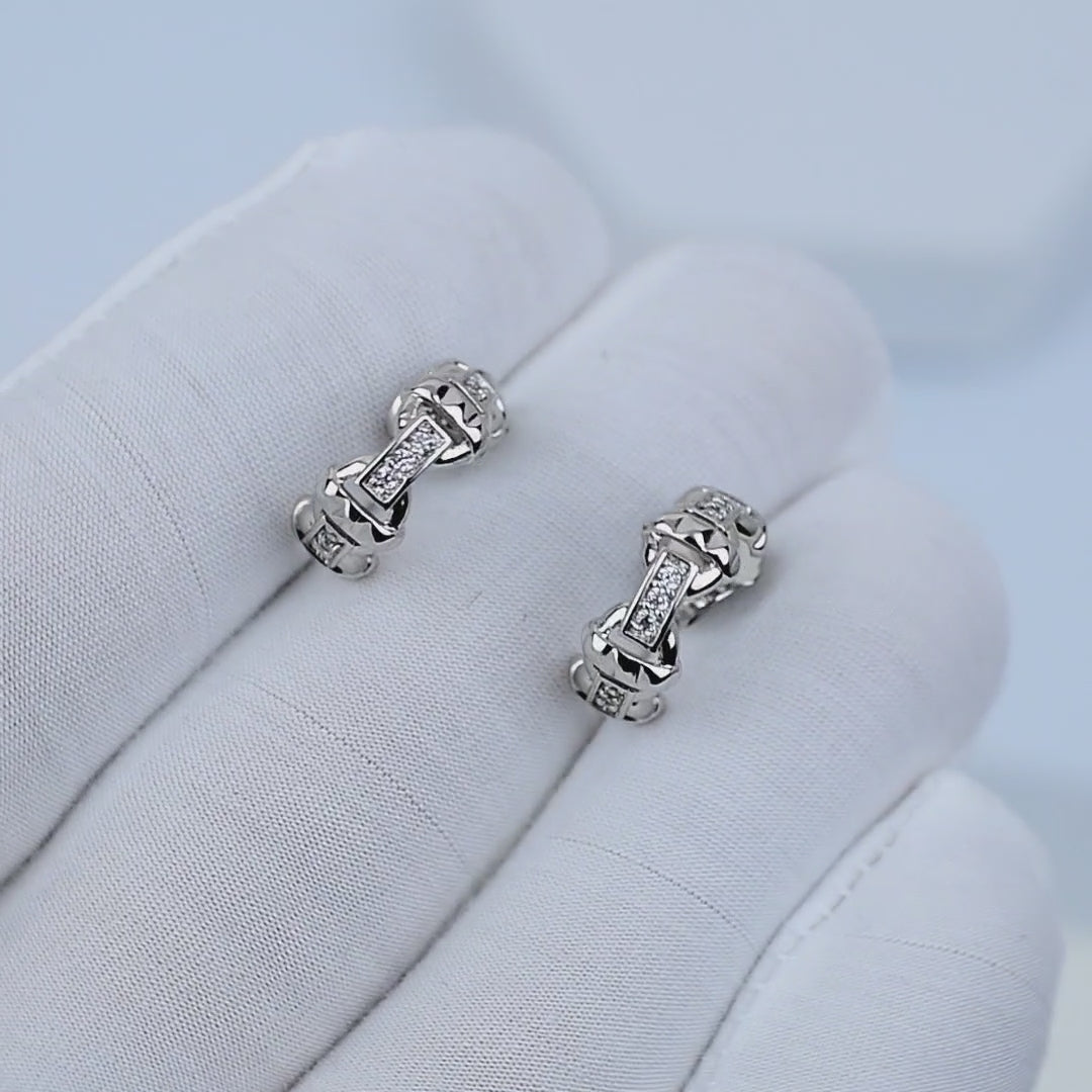 LYRA Mini Hoops rotating to show polished silver stainless steel finish
Close-up motion of lightweight hypoallergenic hoop earrings in movement
Everyday silver hoops reflecting light in clean minimal styling