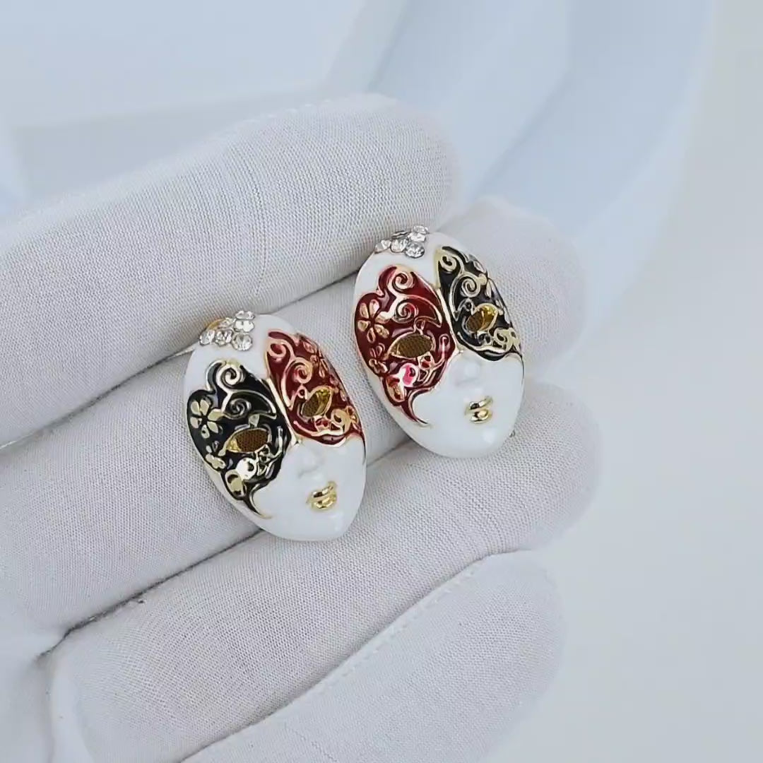 Video capturing the light reflecting off the crystal cluster and the detailed gold accents of the Masque Surrealist earrings