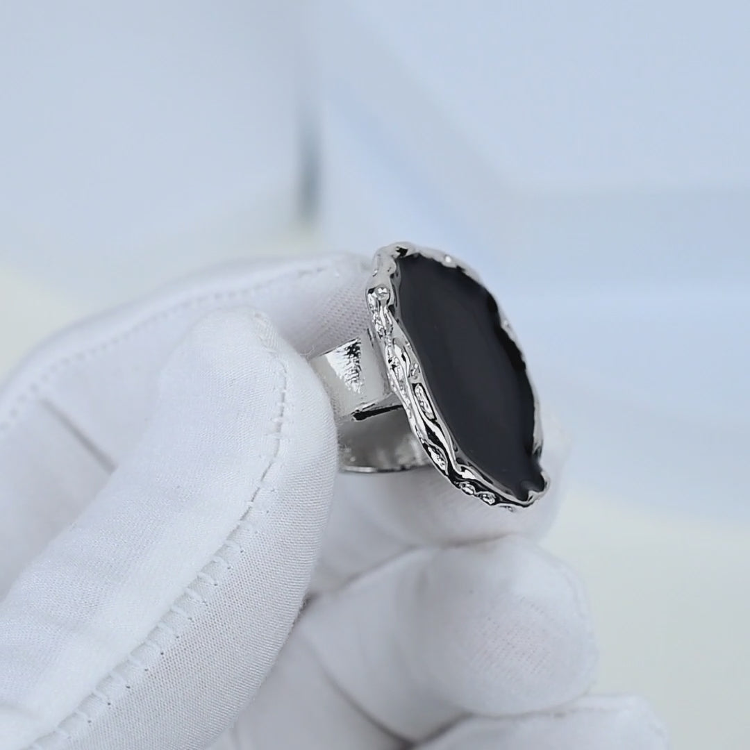     Luxury-inspired black enamel cocktail ring for statement styling.