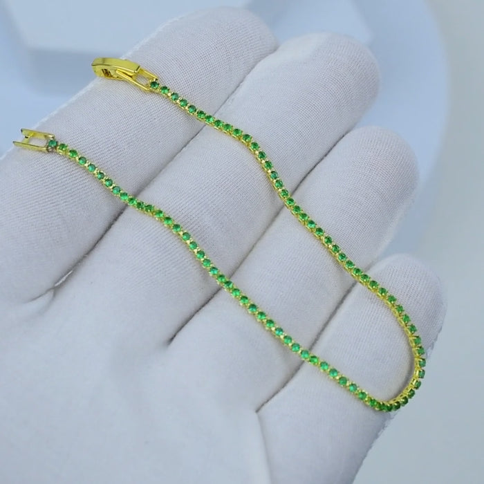     Stackable emerald green bracelet with secure clasp.