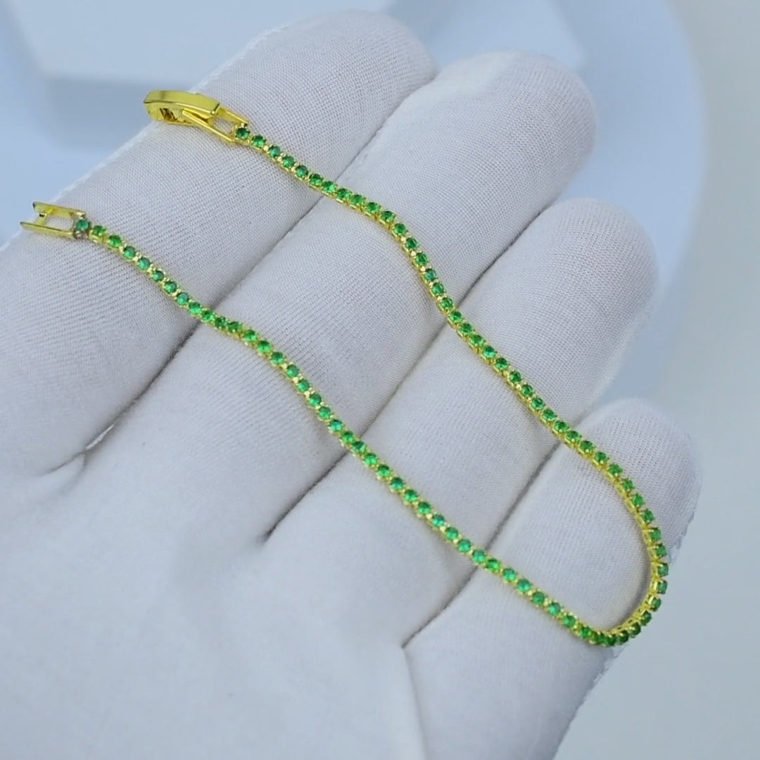     Stackable emerald green bracelet with secure clasp.
