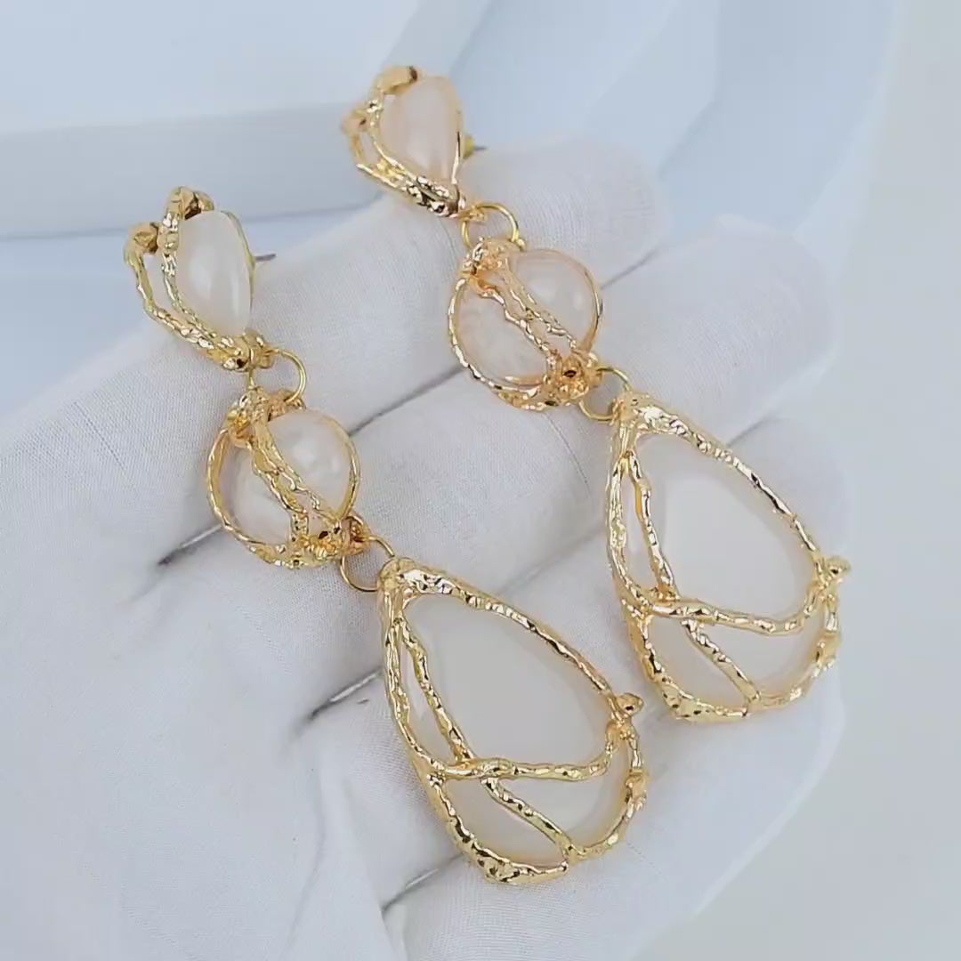 Video showcasing the rich texture of the gold branch setting on the Ivory Vine drop earrings