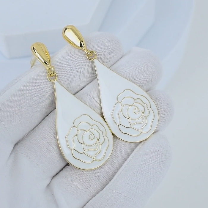 Video showcasing the reflective gold finish and high-gloss enamel of the Alabaster Rose teardrop earrings