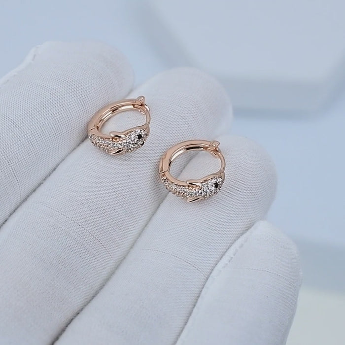 ELVA Mini Hoops rotating to show rose gold tone plated stainless steel finish
Close-up motion of lightweight hypoallergenic hoop earrings in soft movement
Everyday mini hoops reflecting warm light in clean minimal styling