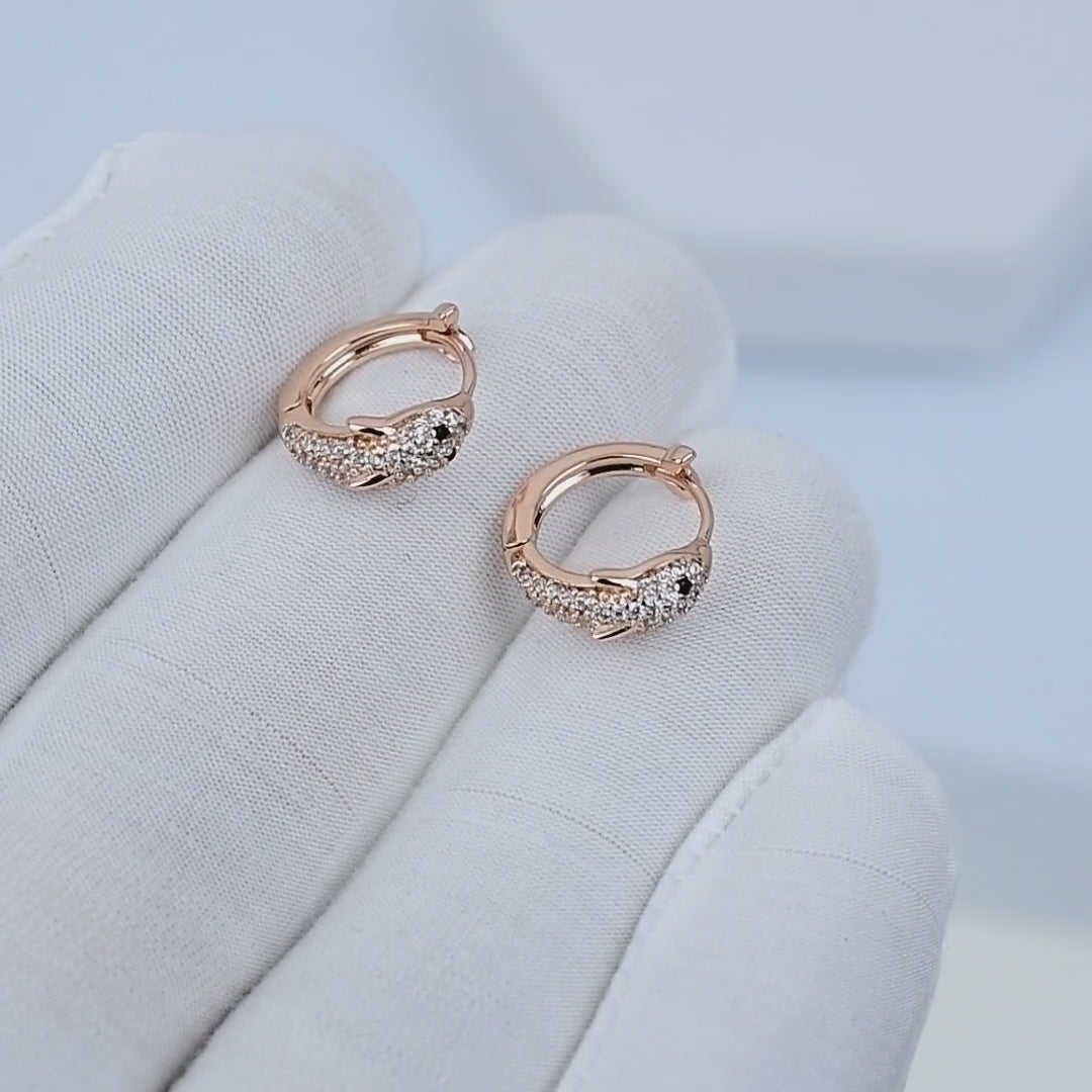 ELVA Mini Hoops rotating to show rose gold tone plated stainless steel finish
Close-up motion of lightweight hypoallergenic hoop earrings in soft movement
Everyday mini hoops reflecting warm light in clean minimal styling