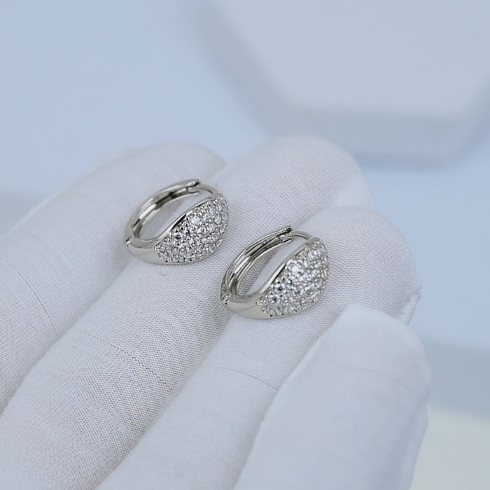     Close-up motion of minimal mini hoop earrings highlighting lightweight structure