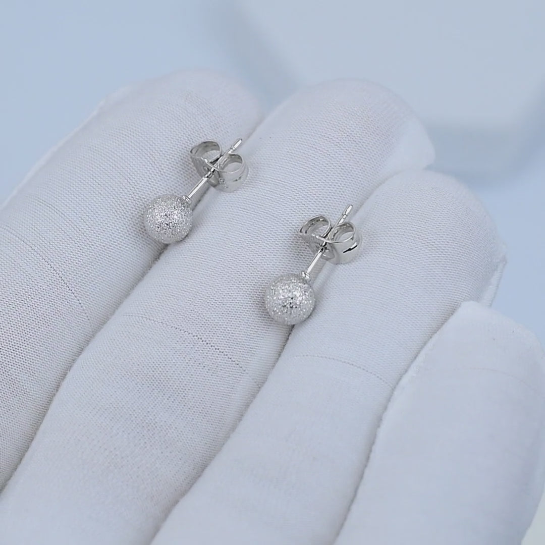 Side view of stainless steel disco ball stud earrings
