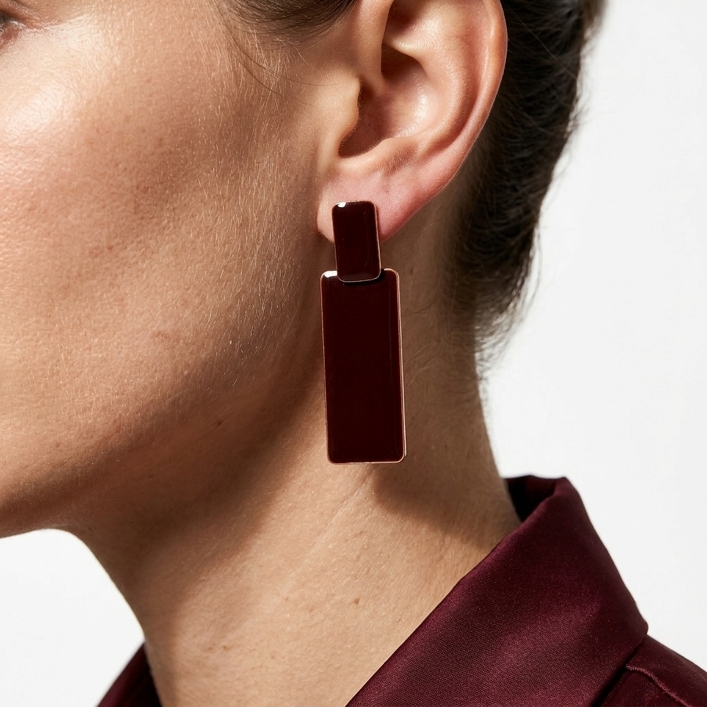 Model wearing the brown Sienna anti-tarnish geometric drop earrings to showcase scale